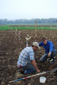 Bennet and Jeff planting trees