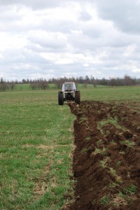 Bennet plowing ground for spring grain trials